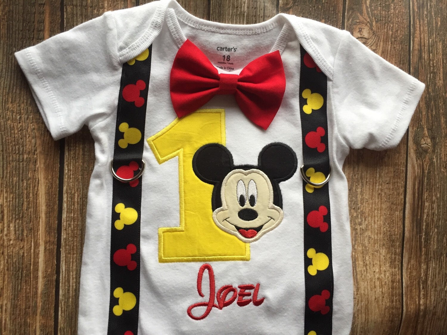 Custom boys first birthday Mickey Mouse bodysuit with suspenders and bow tie,